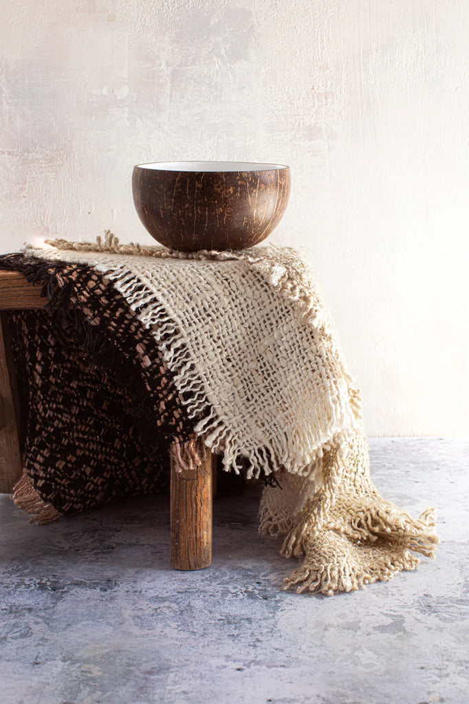 coconut bowl on wooden stool